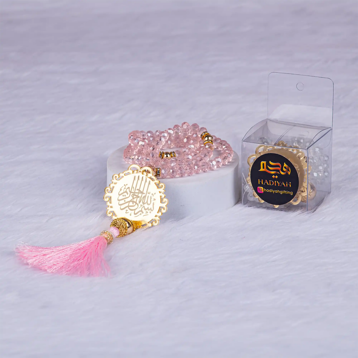 Pink crystal tasbih with gold Islamic charm and tassel, included in the Sawab-e-Jariya bridal gift hamper. Ideal for religious gifting.
