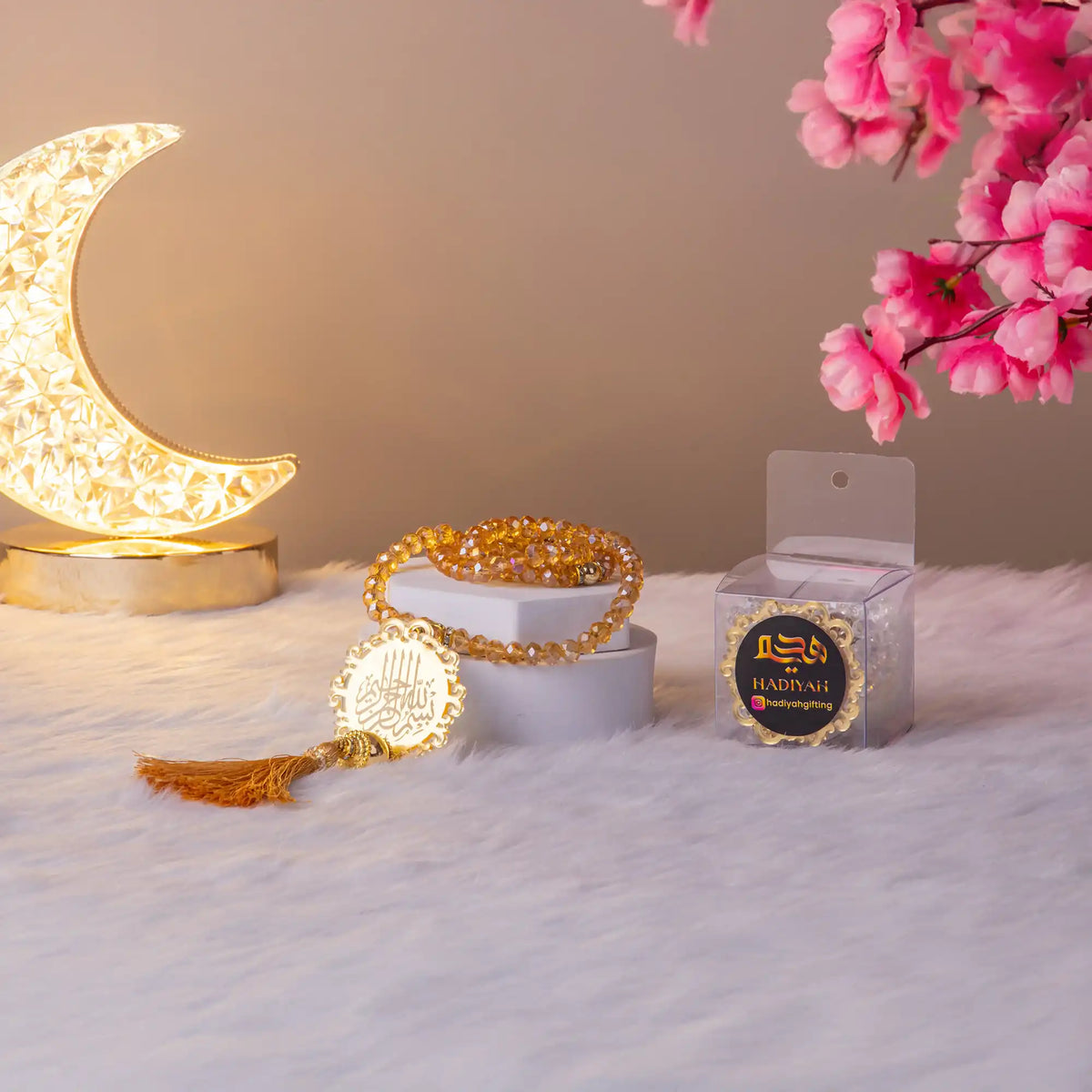 Golden Tasbeeh with tassel and branded packaging from the Golden Sequence Tilawat-e-Quran Gift Hamper, ideal for gifting during Eid or Nikah.