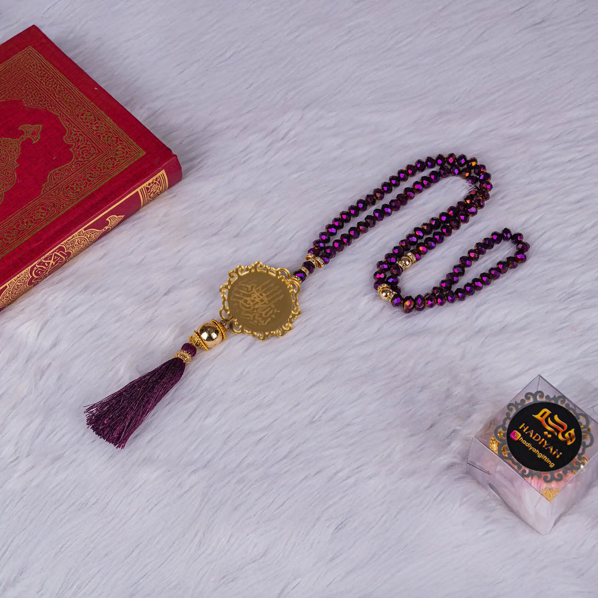 Purple tasbeeh with golden charm and Quran, part of the Purple Sawab-e-Jariya Gift Set. Ideal for Islamic occasions and personal prayer.