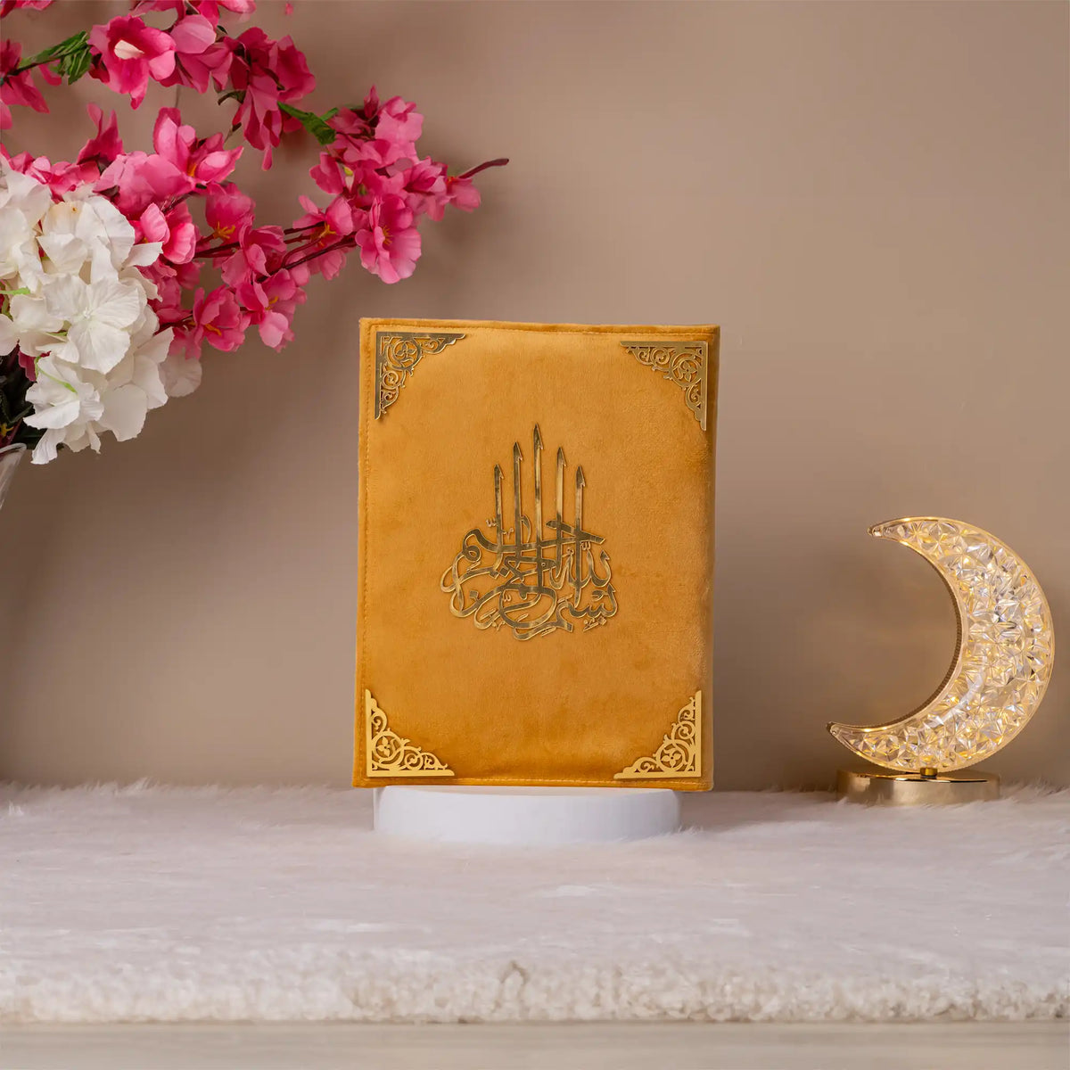 Velvet-covered premium Quran with golden Arabic calligraphy, included in the Golden Floral Pearl Rehal Hamper. Elegant Islamic gift for women and men.