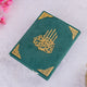 Green book with gold decorative elements on a white background