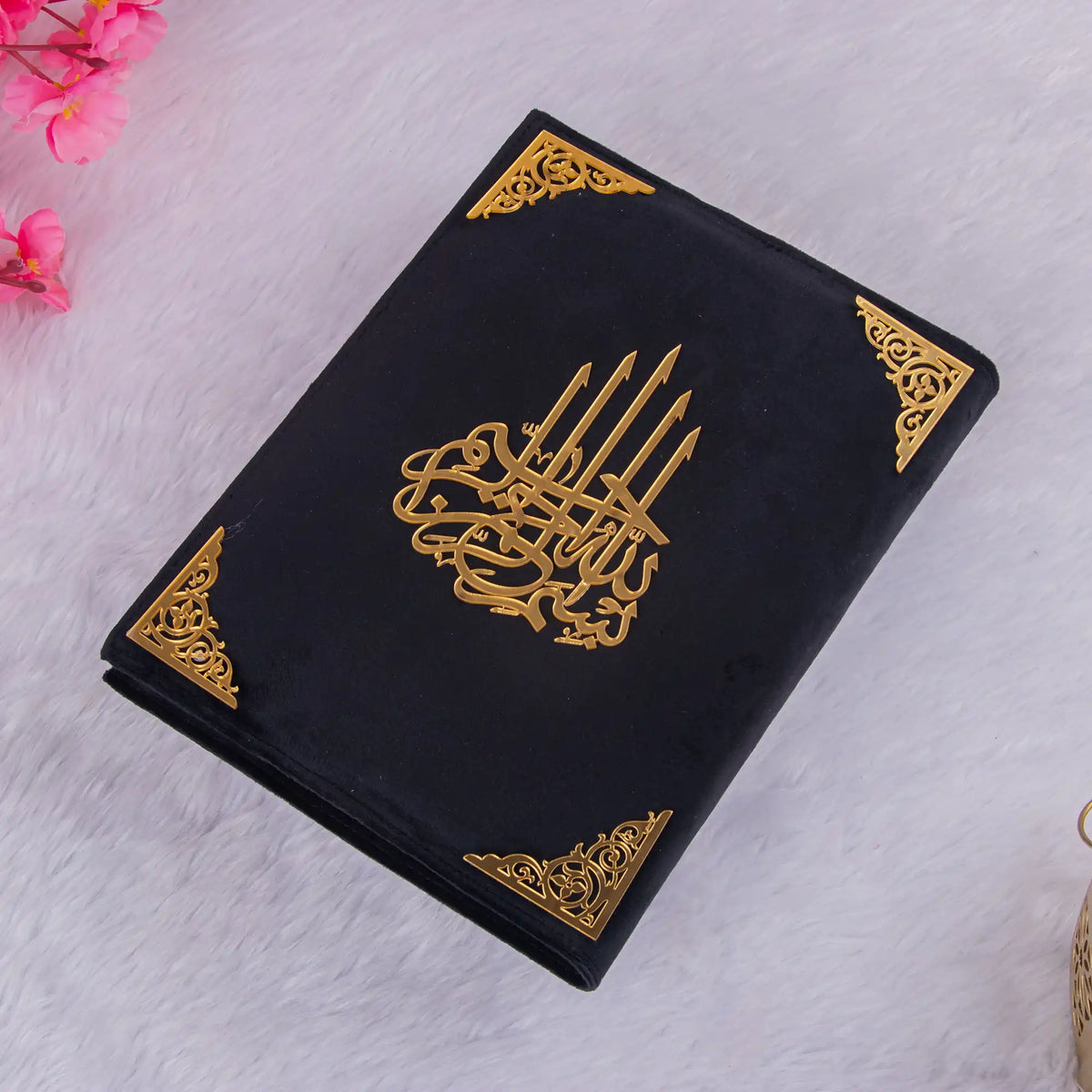 Flat lay of black Premium Velvet Quran with gold accents, perfect for prayer essentials or gifting.