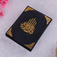Flat lay of black Premium Velvet Quran with gold accents, perfect for prayer essentials or gifting.