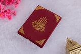 Flat-lay of maroon Velvet Quran with intricate gold detailing from Amaanat-e-Nikaah Sawab-e-Jariya luxury bridal nikah gift set