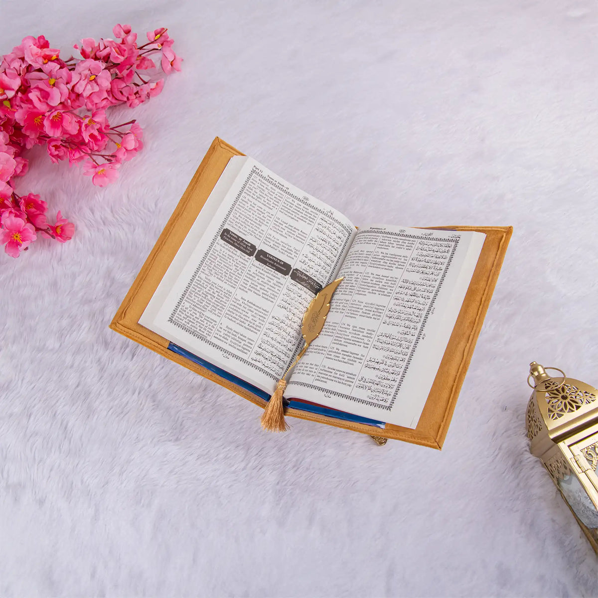 Golden Velvet Quran Translation with Urdu-English text and elegant feather bookmark, ideal for religious gifting during Eid or weddings.