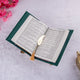 Open book with a decorative bookmark on a light pink background with pink flowers