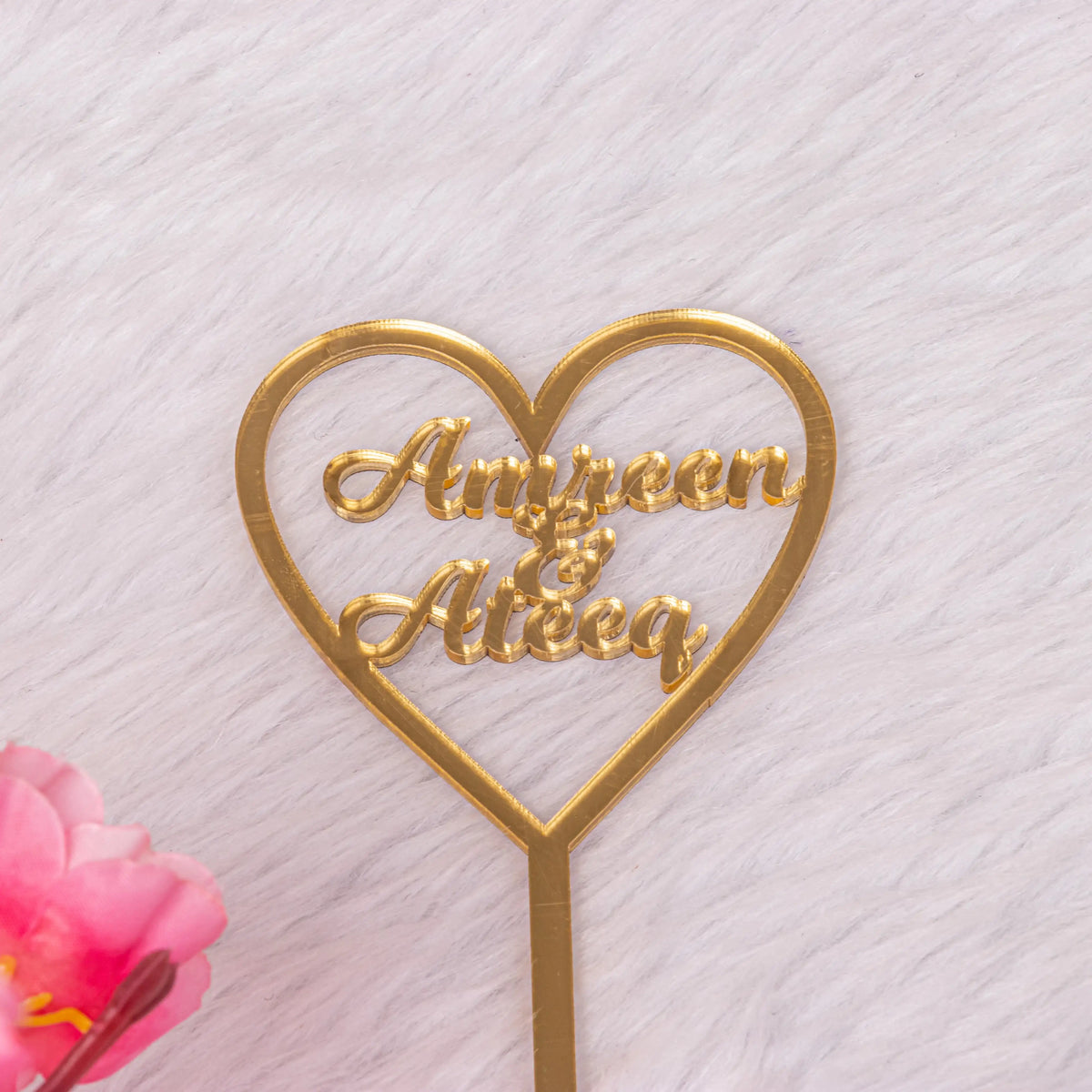 Custom heart-shaped gold name topper with 'Amreen & Ateeq' text, perfect for personalizing Nikah Pen & Golden Rose Gift for weddings.
