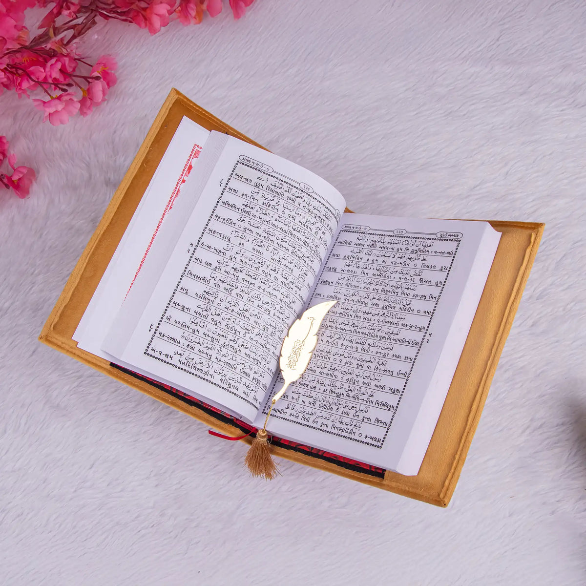 Golden Velvet Quran Translation with Hindi script and gold feather bookmark, a meaningful gift for spiritual and ceremonial events.