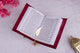 Velvet Quran open to Gujarati translation, premium edition for diverse language speakers and Islamic gift occasions.