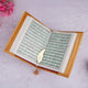 Golden Quran with green bordered Arabic text and gold tassel bookmark, featured in the Golden Sawab-e-Jariya Bling Quran Gift Set.