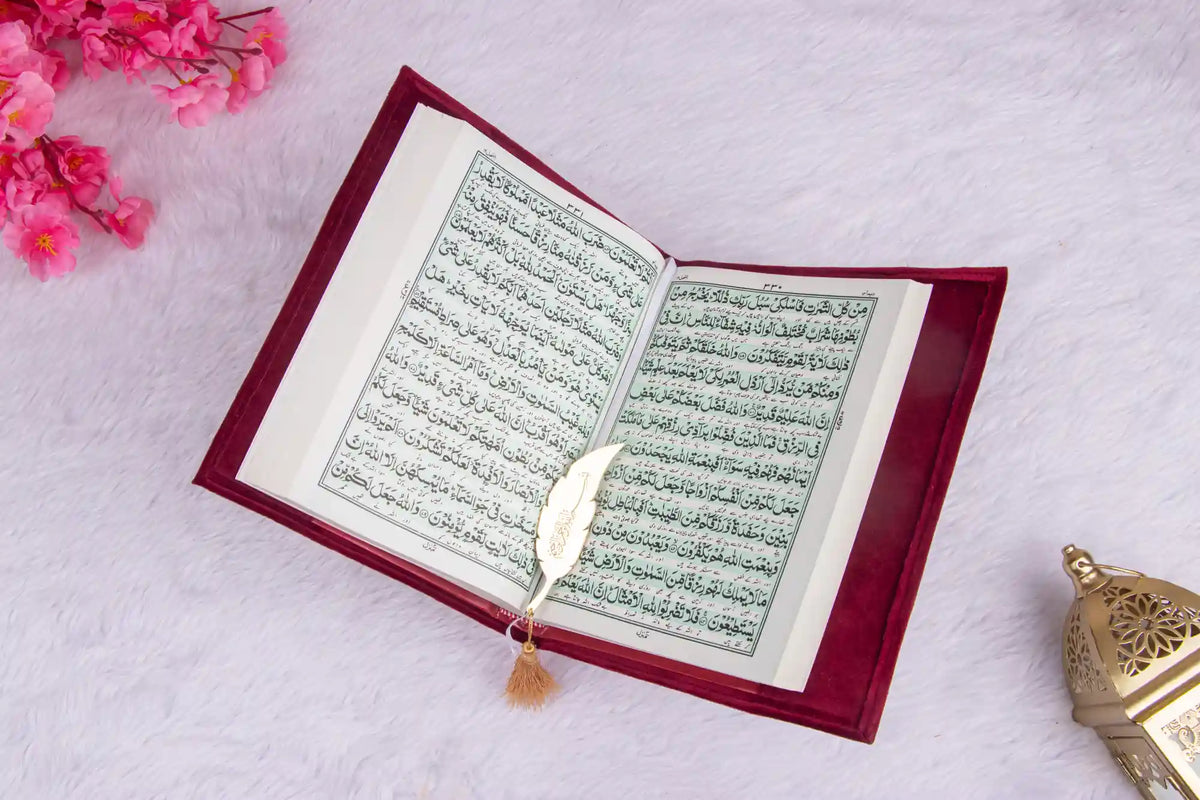 Open Velvet Quran displaying Arabic script, a sacred and beautifully bound prayer essential for daily recitation.