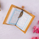 Golden Quran with colorful pages and gold feather bookmark, included in the Golden Sawab-e-Jariya - Bling Quran Gift Set for special occasions.