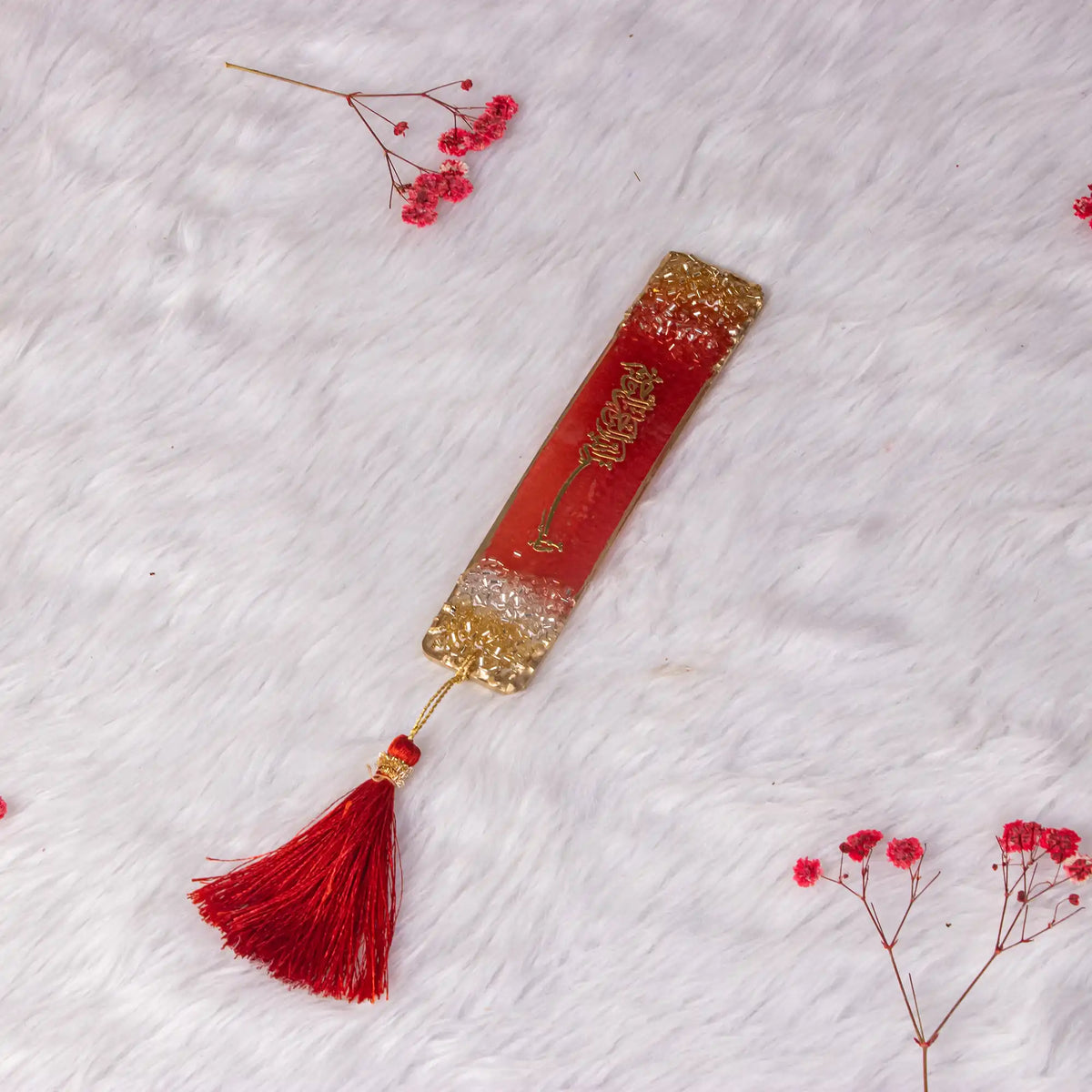 Red and gold resin Islamic bookmark with tassel from Amaanat-e-Nikaah Sawab-e-Jariya Quran gift set for weddings.