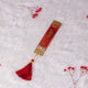 Red and gold resin Islamic bookmark with tassel from Amaanat-e-Nikaah Sawab-e-Jariya Quran gift set for weddings.
