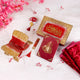Flat lay of Barkat-e-Nikah maroon Sawab-e-Jariya gift set featuring Quran, Rehal, Tasbeeh, and ornate gift box for Islamic wedding blessings.