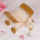 Gold and offwhite resin Quran stand from the Offwhite Sawab-E-Jariya Hamper, designed for elegant religious presentation and use.