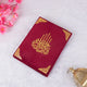 Flat lay of red velvet Kaaba Quran with intricate gold calligraphy, a luxurious and personalizable Islamic gift item.