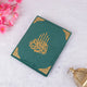Green Kaaba Quran laid flat with gold calligraphy, a handcrafted and elegant gift for weddings and religious events.