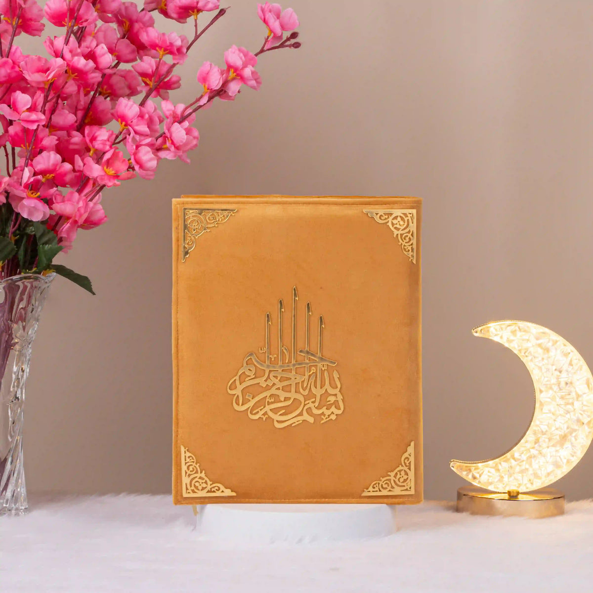 Orange velvet Kaaba Quran with gold embellishments, upright with crescent lamp, a unique and elegant religious gift box.