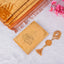 Golden Salah Combo Hamper with velvet Quran, golden Janamaz, and crystal Tasbeeh on white fur background. Ideal Islamic gift set.