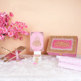 Top view of Pink Sequence Bridal Hamper - Sawab-e-Jariya featuring glitter Rehal, premium Quran, and accessories in a designer box.