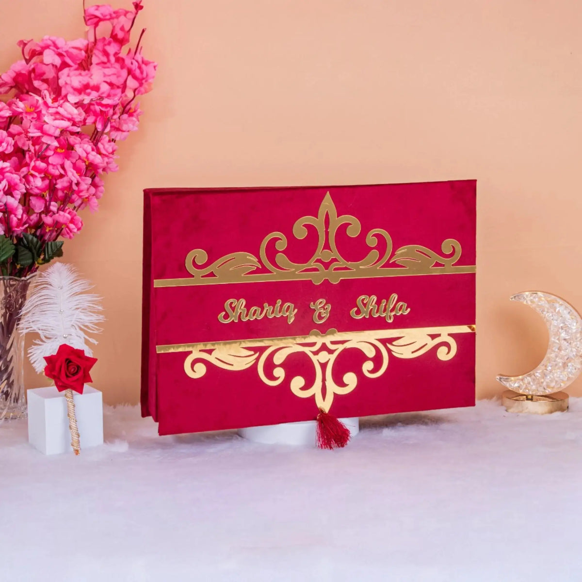 Personalized Maroon Nikah Nama velvet box with gold Islamic motifs and couple's names, ideal for wedding ceremony gifting and keepsakes.
