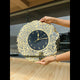 Gold-accented Surah Al Ikhlas Wall Clock displayed outdoors, highlighting its spiritual charm and premium finish for home or office use.