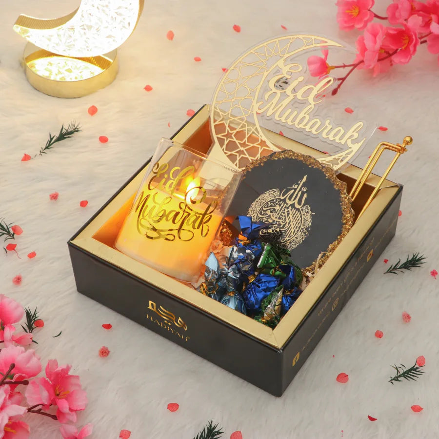Tawakkul Eid Hamper - Tawakkul Eid gift hamper with Eid Mubarak acrylic decor, candle, Islamic frame, and assorted chocolates in a luxury gift box. Main image
