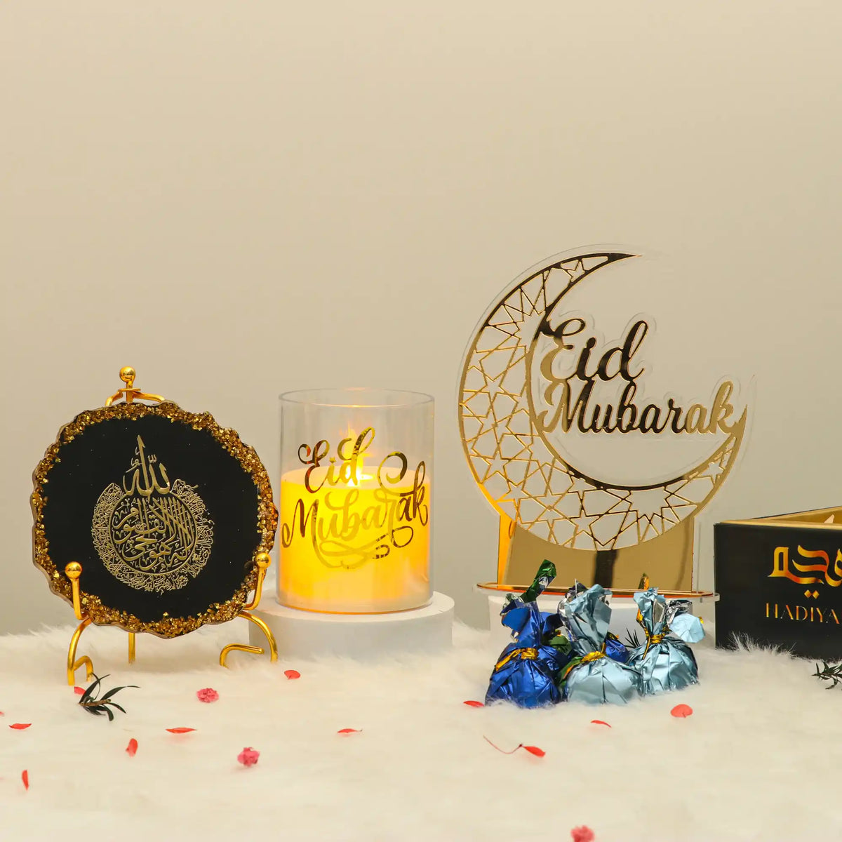 Decorative items with 'Eid Mubarak' text on a beige background