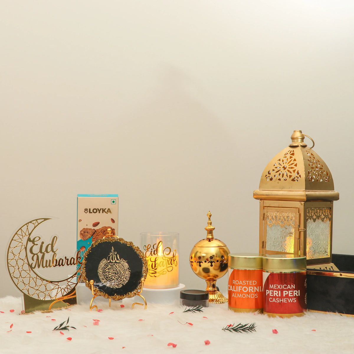 Premium Sukoon Eid Hamper with festive gold decor, bakhoor, roasted nuts, and cookies, perfect for Eid-al-Adha and Eid-ul-Fitr celebrations.