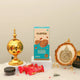 Jannah Eid Hamper - Celebrate Eid with Premium Gifts with white Ayatul Kursi frame, golden incense burner, almond cookies, and gourmet caramel bites for festive gifting.