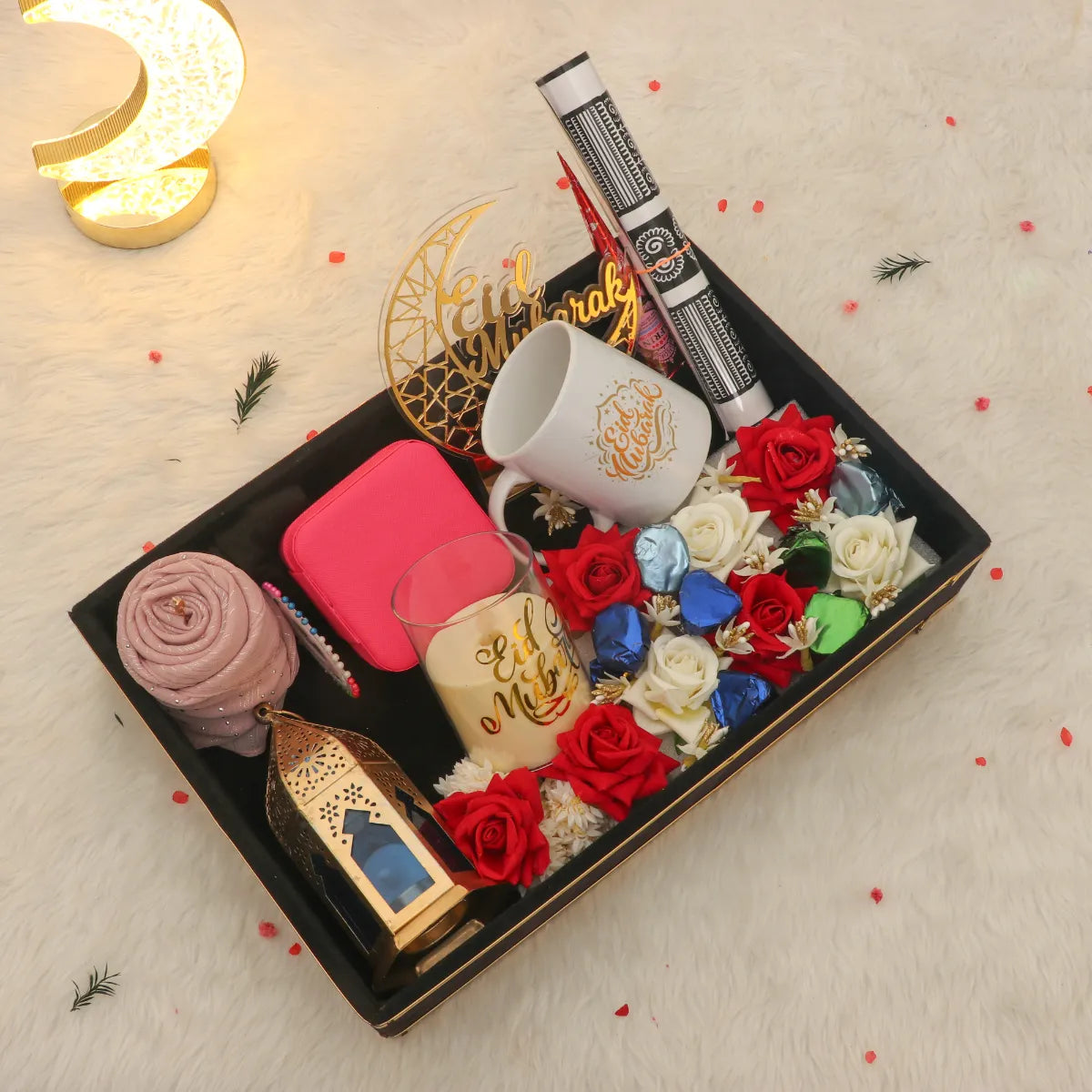 The Nazarana Eid Set - Gift Set | Elegant Essentials featuring a hijab, Eid Mubarak mug, lantern, chocolates, and roses in a decorative gift box. Main image