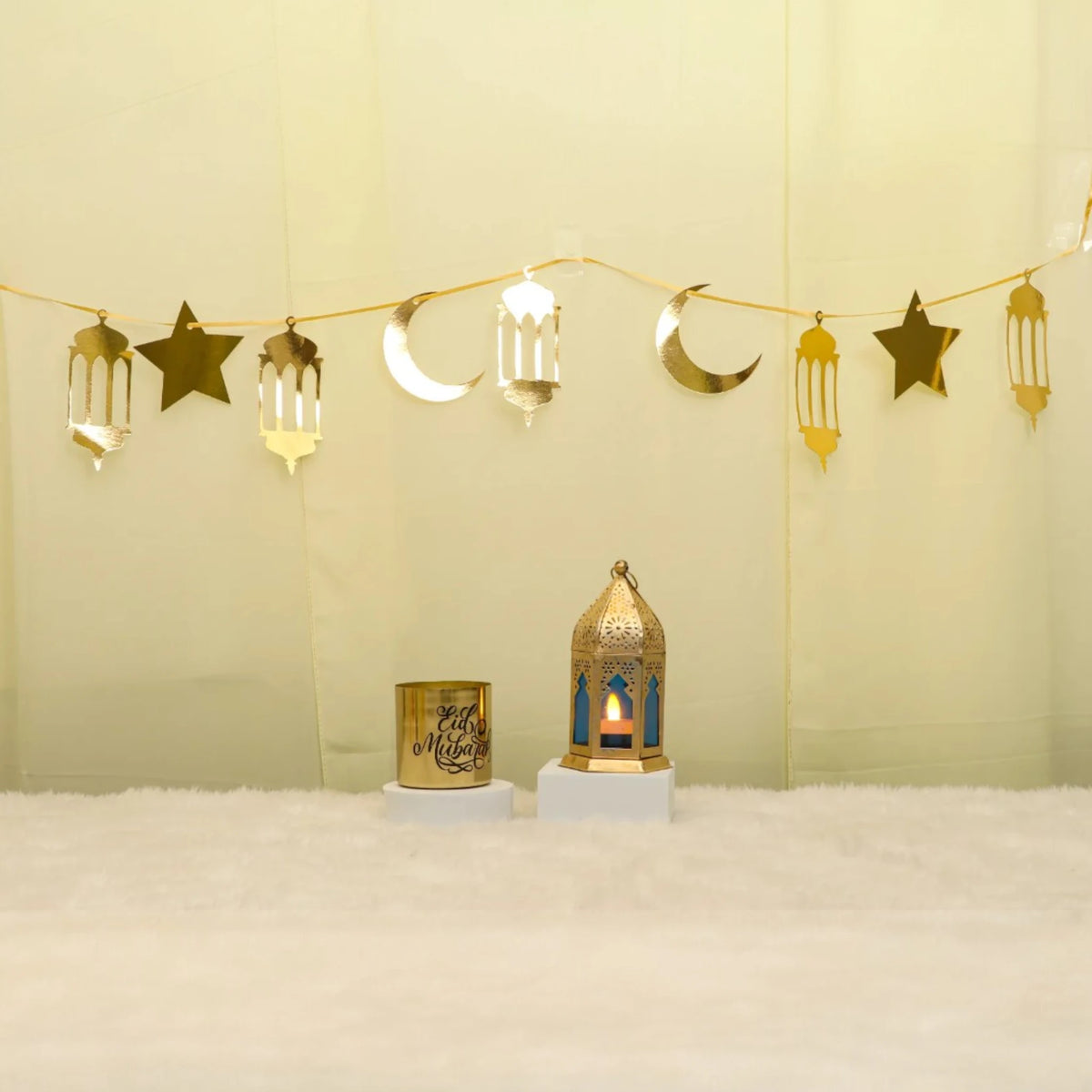 Lunar Serenity Decor Set - Eid Decor Set with gold star and moon banner, medium lantern, and Eid Mubarak scented candle for festive home decor.