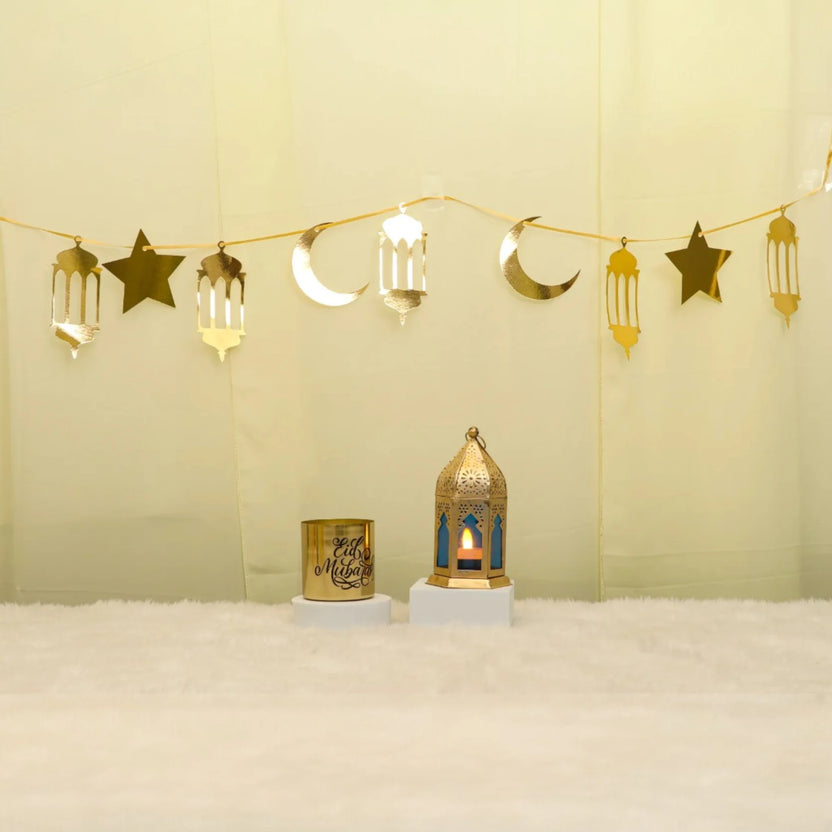 Lunar Serenity Decor Set - Eid Decor Set with gold star and moon banner, medium lantern, and Eid Mubarak scented candle for festive home decor. Main image