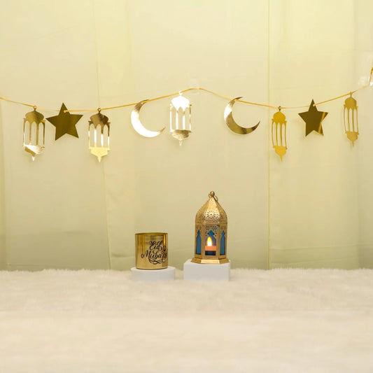 Lunar Serenity Decor Set - Eid Decor Set with gold star and moon banner, medium lantern, and Eid Mubarak scented candle for festive home decor.