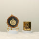 Divine Light Decor Set - Eid Decor Set featuring a black and gold Ayatul Kursi frame and a gold Eid Mubarak candle. Elegant Islamic home decoration.