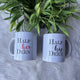 Custom Couple Ceramic His & Her Deen Mug 350ml Gift set placed on faux fur with plant decor. Personalized mugs perfect for wedding or anniversary gifts.