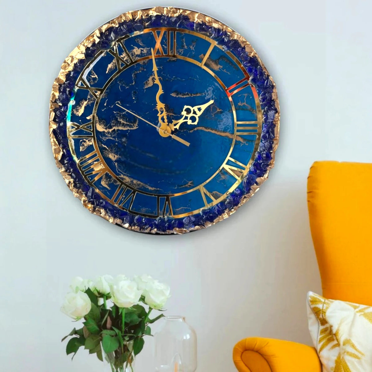 Elegant Handmade Wall Clock in navy blue and gold, hung beside a yellow chair and white roses, perfect for stylish home decor.