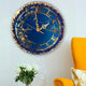 Elegant Handmade Wall Clock in navy blue and gold, hung beside a yellow chair and white roses, perfect for stylish home decor.