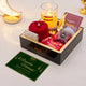 Red hijab Ibadat Ramadan Box gift hamper with tasbih, sweets, and Ramadan Mubarak greeting card for festive occasions.