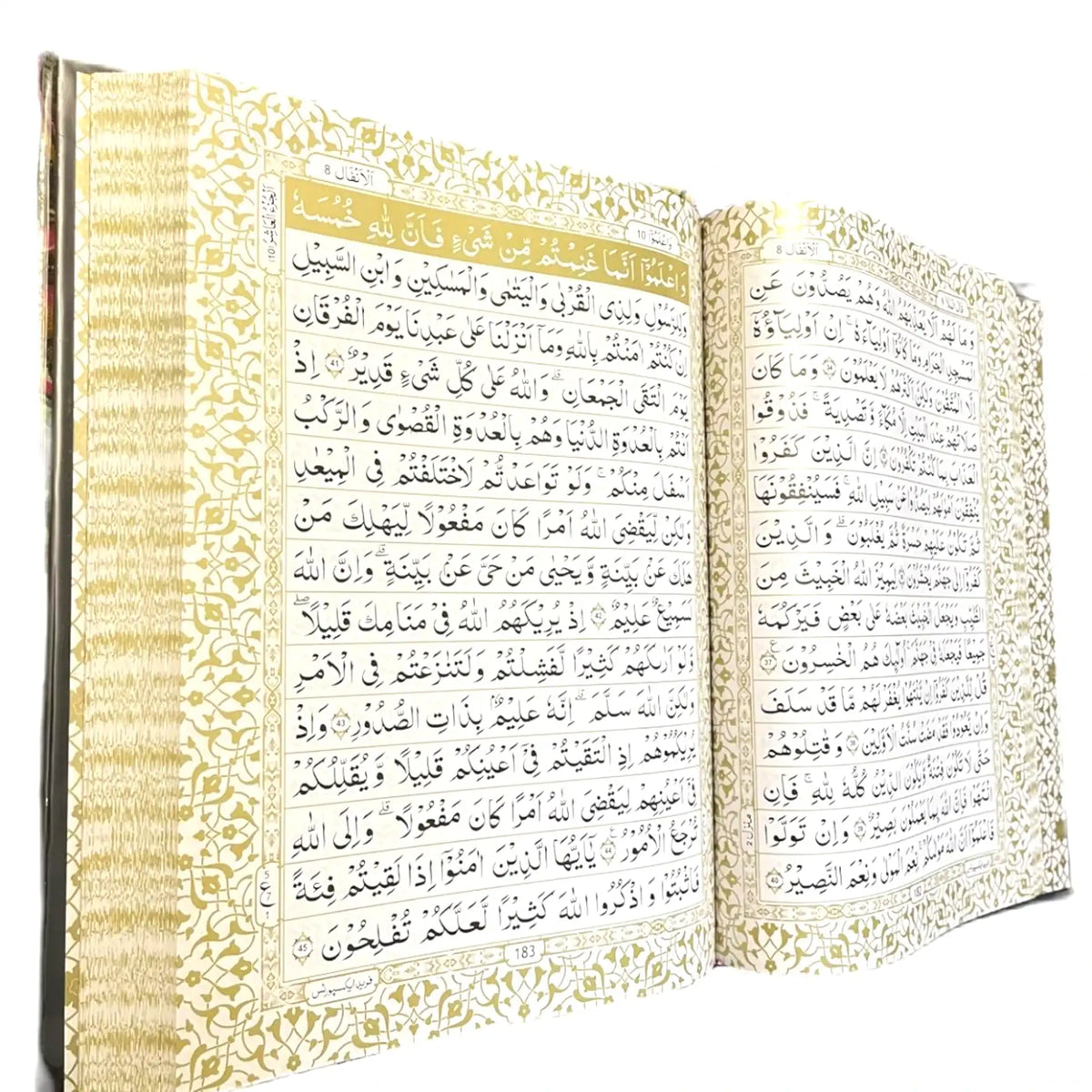 Open book with Arabic text on a white background