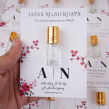 Premium Attar Card Favor close-up – mini 3ml Dunhill ittar bottle on customised floral card, meaningful Islamic Nikah and Mehndi favor at ₹110 each