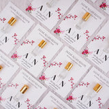 Premium Attar Nikah Favors displayed – 3ml alcohol-free ittar glass bottles on personalised floral cards, elegant return gift for Nikah and Walima ceremonies