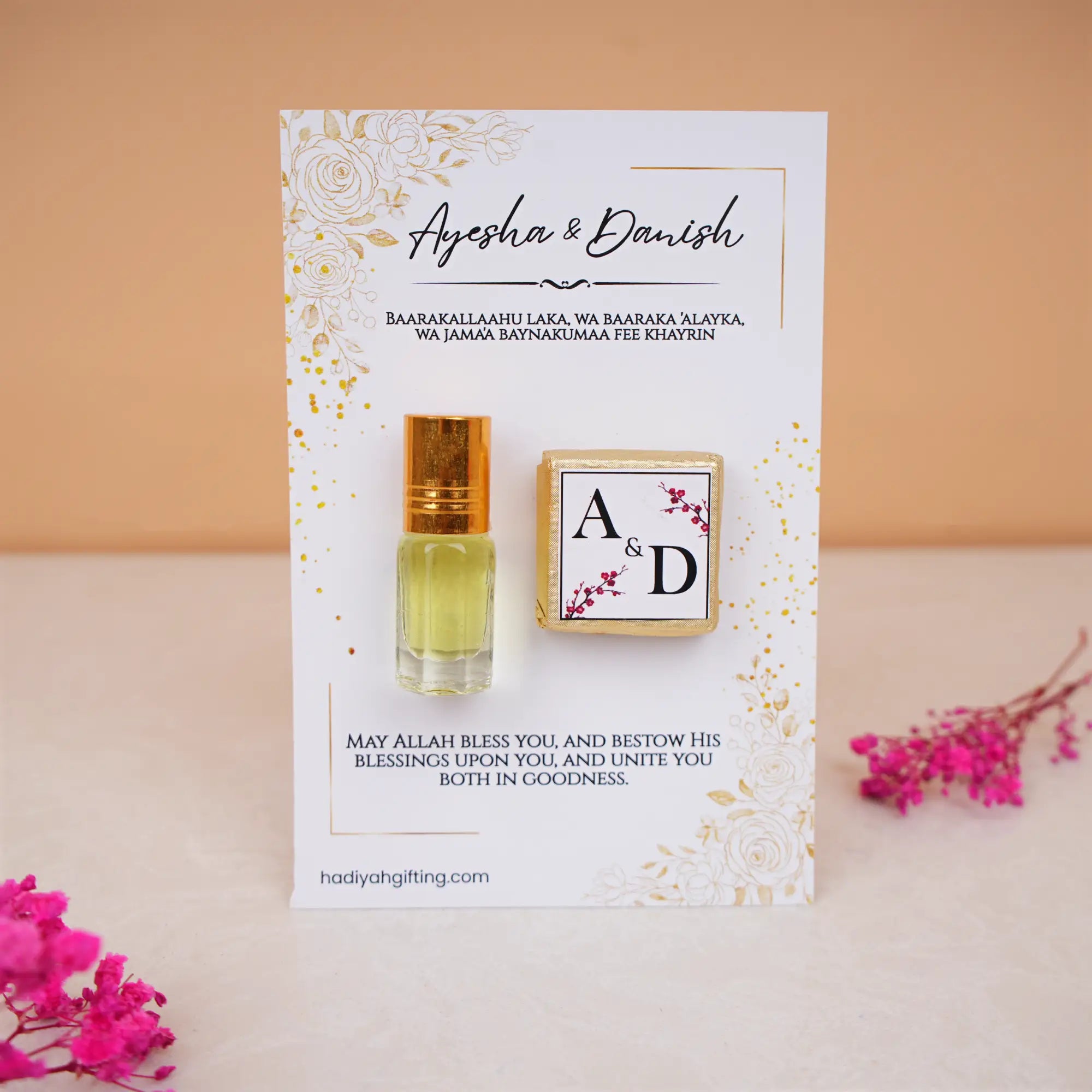 Premium Ittar & Chocolate Customised Card Favors for Nikah featuring a gold-capped ittar bottle and monogrammed chocolate on floral card.