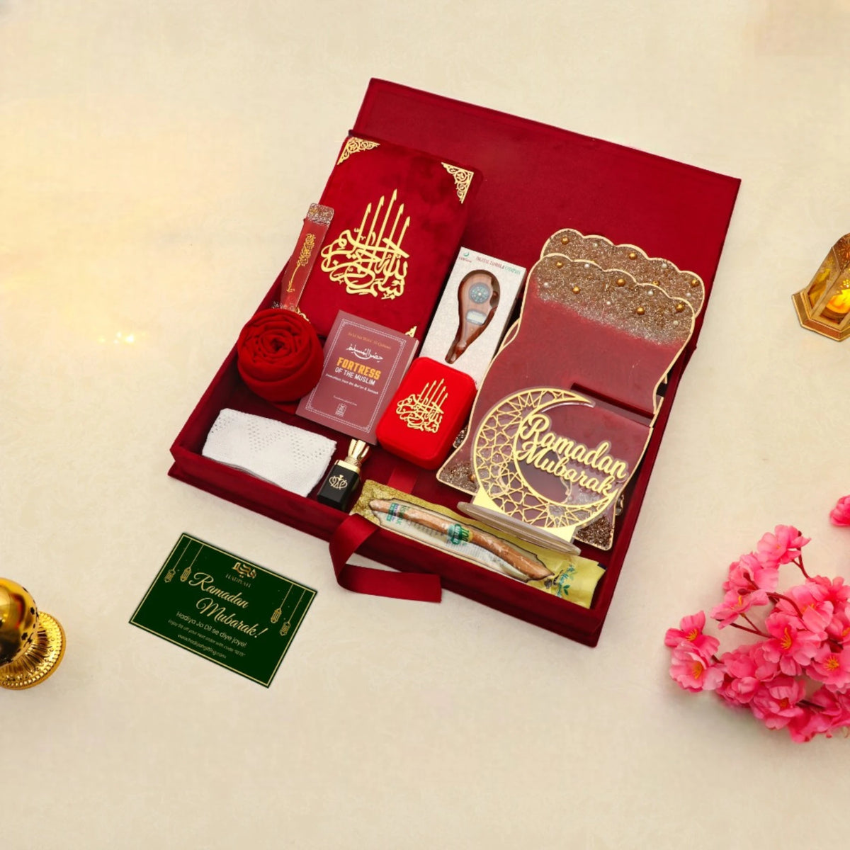 Open Jannah Treasures Ramadan Hamper in red showcasing Quran, tasbeeh, ittar, miswak, and prayer essentials for spiritual Ramadan gifting.
