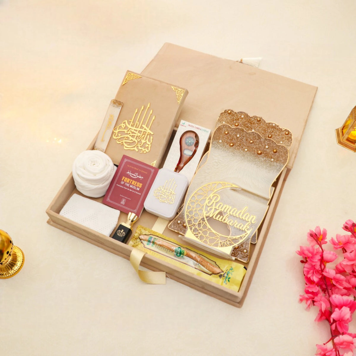Open beige Jannah Treasures Ramadan Hamper with Quran, tasbeeh, ittar, miswak, and prayer items, perfect for Ramadan and Eid gifting.