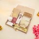 Open beige Jannah Treasures Ramadan Hamper with Quran, tasbeeh, ittar, miswak, and prayer items, perfect for Ramadan and Eid gifting.