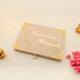 Beige Jannah Treasures Ramadan Hamper closed box with 'Ramadan Mubarak' and crescent moon design, elegant for ceremonial gift giving.
