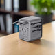 Jetset International Travel Adapter showing EU plug and multiple sliders for global compatibility. Compact design for worldwide use.