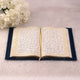 Open Quran with ornate border design from the Blue Sequence Rehal Hamper, perfect for decorative Islamic gifting and personal devotion.